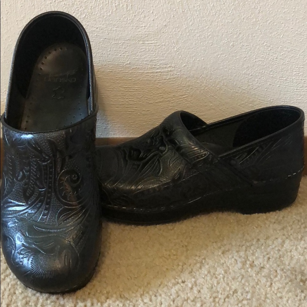 Black danskos with design.